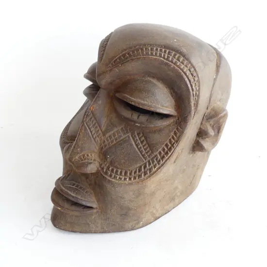 A small vintage African tribal carved mask,